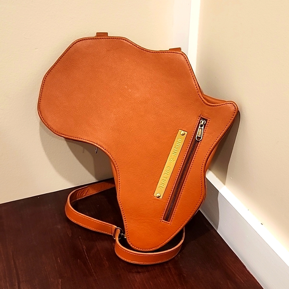 ORIJIN CULTUREAFRICA SHAPED BAG / BACKPACK- BROWN LEATHER (MEDIUM) . Price Firm.